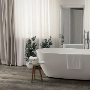 White tub and decor in light room. Interior design